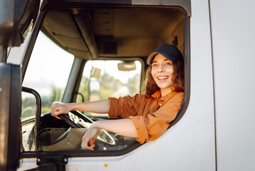 Truck driver woman, trucker occupation in Europe for females. People and industrial transportation concept.