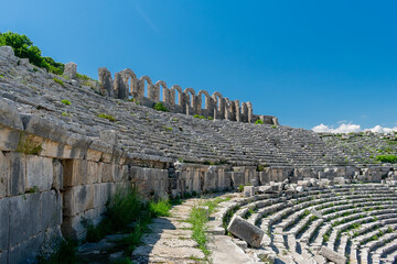 Picturesque ruins of an amphitheater in the ancient city of Perge, Turkey. Perge open-air museum.