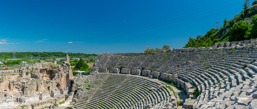 Picturesque ruins of an amphitheater in the ancient city of Perge, Turkey. Perge open-air museum.