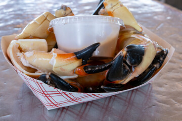 Plateful of Cracked Stone Crab Claws Served with a Mustard Sauce Ready to be Enjoyed