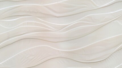 A close-up view of a white wavy textured wall that gives off a modern and elegant vibe. 