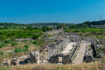 Obraz premium View from a height of the ancient city of Perge. Ancient city surrounded by dense green vegetation.
