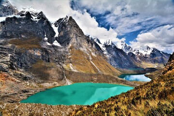 View of the Huayhuash mountain range (with the highest peaks Siula Grande (6344 m) and Yerupajá...