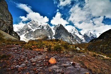 View of the Huayhuash mountain range (with the highest peaks Siula Grande (6344 m) and Yerupajá...