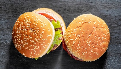 macro photo of three hamburgers on black kitchen granite surface top view