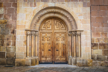 Church door of Nuestra Señora la Mayor with the statue of Leonor Izquierdo in the spanish city of...
