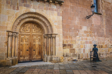 Church door of Nuestra Señora la Mayor with the statue of Leonor Izquierdo in the spanish city of...