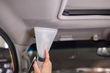 Carwash service, cleaning of car ceiling covering