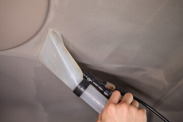 Carwash service, cleaning of car ceiling covering