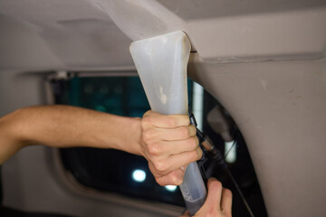 Carwash service, cleaning of car ceiling covering