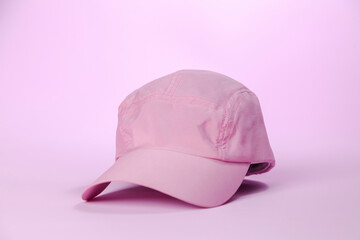 Pink cap on pink background. Women's cap concept. Cap concept