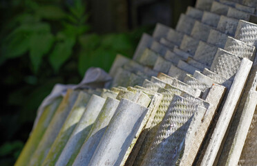 Stack of asbestos roofing sheets. Carcinogenic eternite.