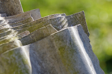 Stack of asbestos roofing sheets. Carcinogenic eternite.