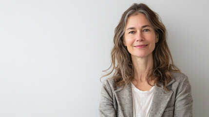 Confident Businesswoman with Subtle Smile in Casual Office Attire