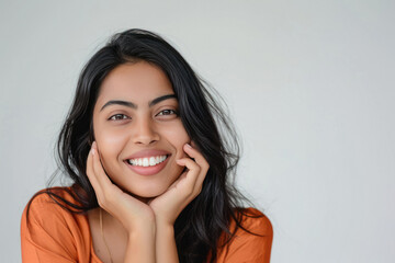 Young beautiful indian woman giving happy expression
