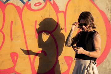 Young woman with alternative style on the phone