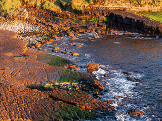 Rough stone coastline and water of Atlantic ocean. Mullaghmore head area, Ireland.