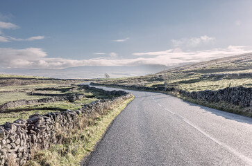 Winding Road Through The Countryside Around Malham Dale In The Yorkshire Dales