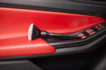 Vehicle dashboard includes a brush