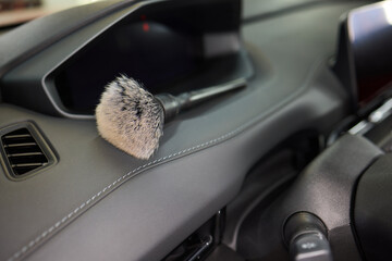 Vehicle dashboard includes a brush