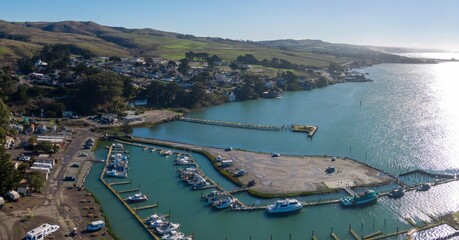 Aerial of ocean, township and marina in Bodega Bay, California, United States of America.