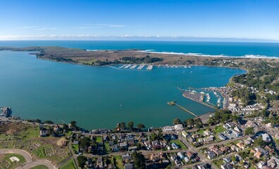 Fototapeta premium Aerial of ocean, township and marina in Bodega Bay, California, United States of America.