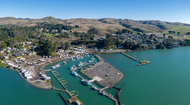 Aerial of ocean, township and marina in Bodega Bay, California, United States of America.