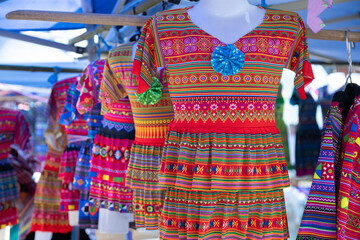 Colourful Flower Hmong clothing for sale at Can Cau Market in Lao Cai Province, Vietnam
