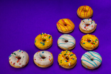 Ten Donuts On A Purple Background With Copy Space