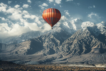 A single balloon drifting against a backdrop of a majestic mountain range, showcasing the beauty of nature.