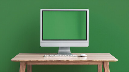 Minimalistic workspace with monitor . The monitor displays a green screen, wooden table tecnology set