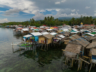 Top view of Stilt houses in the Zamboanga coastline. Clear turquoise water. Mindanao, Philippines.