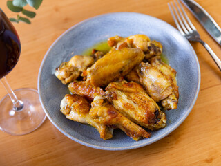 Plate of tasty snack - roasted chicken wings