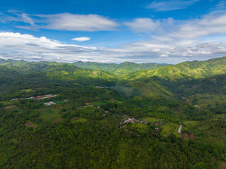 Naklejka premium Mountain landscape: Mountain slopes covered with rainforest and jungle. Mindanao, Philippines.