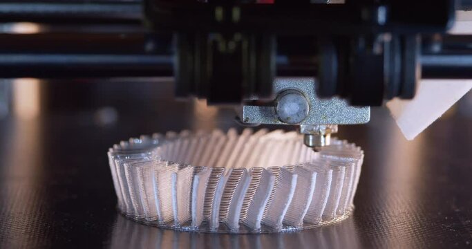 3D printer working. Fused deposition modeling, FDM. 3D printer printing an object from plastic. Automatic three dimensional 3d printer performs plastic. Progressive additive technology for 3d printing