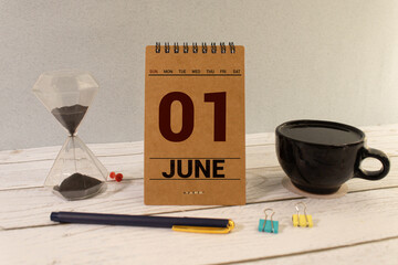 June 1st. Day 1 of month, calendar on yellow background. First summer day.