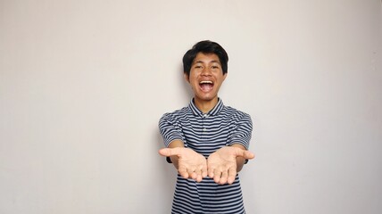 excited young asian man showing open palm