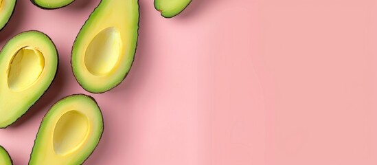 Avocado design on a pink background seen from above in a banner format. Pop art inspired,