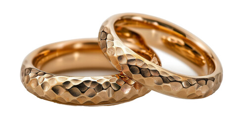 Obraz premium Ornate golden wedding bands with intricate engraving isolated on transparent background