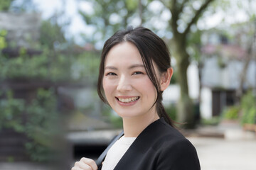 Young woman in suit outdoors Close-up camera view Image of sales, outside, and young recent...