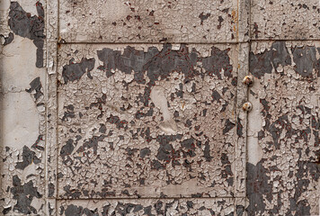 Background image from an old rusting door paint peeling off has a grunge look