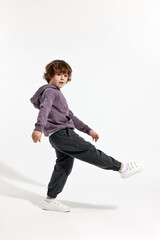 Fashion concept. Stylish boy posing on white background