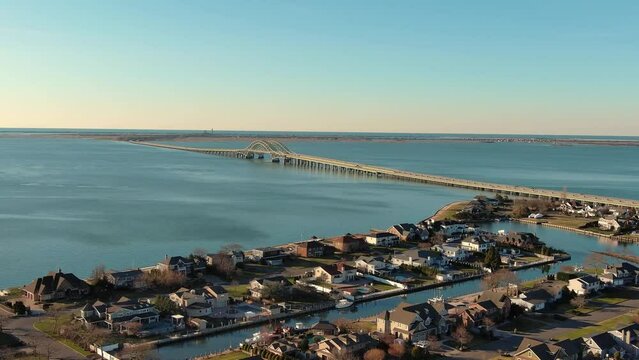 Robert Moses Causeway West Islip Long Island Great South Bay New York at sunrise homes Aerial Blue