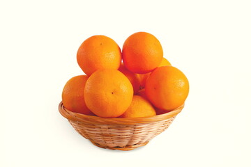 fresh ripe orange fruit isolated in basket, white background