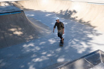54 year old Brazilian skateboarder having fun at a skate park on a sunny day_14.