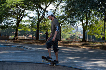 54 year old Brazilian skateboarder having fun at a skate park on a sunny day_1.