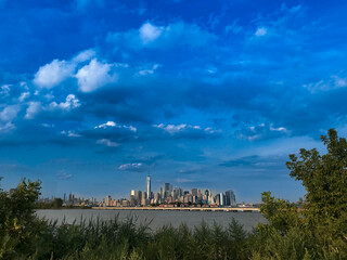Manhattan New York skyline with blue clouds