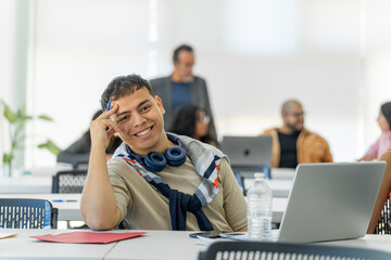 Portrait of a relaxed lgbt man looking at the camera at the university.