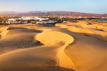 Landscape with Maspalomas town and golden sand dunes, Gran Canaria, Canary Islands, Spain. Natural Reserve of Dunes of Maspalomas, in Gran Canaria, Canary Islands, Spain.