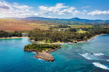 Aerial panoramic of waves of Indian Ocean and turquoise coral reef, Poste Lafayette, East coast,...